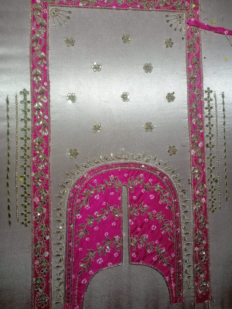 A pink framed panel with scattered gold details on an ivory ground.